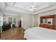Spacious bedroom with tray ceiling, wood-look floors, and natural light at 315 Antioch Road, Mcdonough, GA 30252
