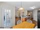View of the dining area open to the kitchen and living area with outdoor access at 315 Antioch Road, Mcdonough, GA 30252