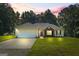 Charming home featuring a well-manicured lawn, complemented by a two car garage and brick facade at 315 Antioch Road, Mcdonough, GA 30252