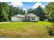 Exterior of a single-Gathering home featuring a manicured lawn and attached garage at 315 Antioch Road, Mcdonough, GA 30252