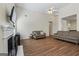 Spacious living room featuring a fireplace, high ceiling, and wood floors at 315 Antioch Road, Mcdonough, GA 30252