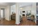 Spacious living room with wood floors, fireplace, high ceiling, and large windows allowing natural light at 315 Antioch Road, Mcdonough, GA 30252