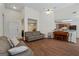 Open concept living room with wood floors, fireplace, and ample seating at 315 Antioch Road, Mcdonough, GA 30252