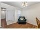 Bright office with a leather chair, wood floors, a lamp, and a window with bright natural light at 315 Antioch Road, Mcdonough, GA 30252