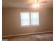 Bedroom with carpeted floors, neutral paint, and a bright window at 4263 Southvale Dr, Decatur, GA 30034