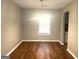 Dining room featuring hardwood floors, a bright window, and neutral paint at 4263 Southvale Dr, Decatur, GA 30034