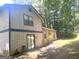 Back of home with patio and many trees at 4263 Southvale Dr, Decatur, GA 30034