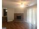 Living room with a brick fireplace, sliding glass doors, and hardwood floors at 4263 Southvale Dr, Decatur, GA 30034