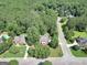 A high angle view of the red brick property located in a lush neighborhood at 100 Castlebrook Chase, Tyrone, GA 30290