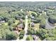 A high angle view highlighting the property and the lush neighborhood with mature trees at 100 Castlebrook Chase, Tyrone, GA 30290