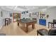 Spacious finished basement with a pool table, fireplace, and stylish blue cabinetry at 100 Castlebrook Chase, Tyrone, GA 30290