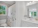 Bright bathroom featuring a white vanity, toilet, and shower with curtain at 100 Castlebrook Chase, Tyrone, GA 30290
