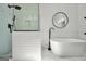 Modern bathroom featuring a free-standing tub, frameless shower, and matte black fixtures at 100 Castlebrook Chase, Tyrone, GA 30290