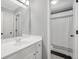 Bathroom featuring vanity with sink, toilet, mirror, and shower in background at 100 Castlebrook Chase, Tyrone, GA 30290