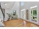 Bright foyer showcases hardwood floors, high ceilings, and elegant decor at 100 Castlebrook Chase, Tyrone, GA 30290