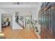 Inviting foyer featuring hardwood floors, high ceilings, and elegant staircase, leading to spacious living areas at 100 Castlebrook Chase, Tyrone, GA 30290