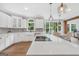 Modern kitchen showcasing bright white cabinetry, stainless steel appliances, and center island at 100 Castlebrook Chase, Tyrone, GA 30290