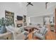 Bright living room with a fireplace, built-in shelves, and hardwood floors at 100 Castlebrook Chase, Tyrone, GA 30290