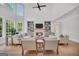 Spacious living room with a fireplace, lots of windows, and hardwood floors at 100 Castlebrook Chase, Tyrone, GA 30290