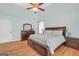 This main bedroom features wood floors, tray ceiling and lots of space at 100 Castlebrook Chase, Tyrone, GA 30290