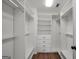 Spacious walk-in closet with custom shelves and storage at 100 Castlebrook Chase, Tyrone, GA 30290