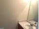 Bathroom features a single sink, laminate countertop, and a standard sized mirror at 2561 Lancewood Ln, Lithonia, GA 30035