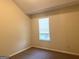 Cozy bedroom featuring neutral walls and carpet, with natural light from a window at 2561 Lancewood Ln, Lithonia, GA 30035