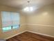 A dining room with neutral tones and a window at 2561 Lancewood Ln, Lithonia, GA 30035