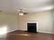 A living room with a fireplace and neutral tones at 2561 Lancewood Ln, Lithonia, GA 30035