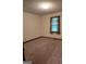 Bedroom with carpet, window, and neutral colored walls at 140 Dixie Ln, Covington, GA 30014