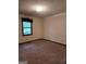 Bedroom with carpet, window, and neutral colored walls at 140 Dixie Ln, Covington, GA 30014