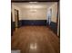 Dining room with hardwood floors, chandelier, blue and white walls, and natural trim at 140 Dixie Ln, Covington, GA 30014