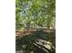 Home featuring a long driveway, lush trees and landscaping creating a peaceful and private setting at 140 Dixie Ln, Covington, GA 30014