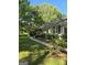 Attractive ranch-style home with mature landscaping and a welcoming sidewalk leading to the front entrance at 140 Dixie Ln, Covington, GA 30014