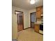 Kitchen with view of dining room with brown cabinets, and appliances at 140 Dixie Ln, Covington, GA 30014