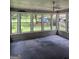 Bright sunroom with multiple windows offering scenic backyard views and plenty of natural light at 140 Dixie Ln, Covington, GA 30014