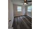 Bedroom features hardwood floors and natural lighting creating a bright and inviting space at 993 Roosevelt Se Dr, Atlanta, GA 30354