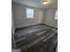 A well-lit bedroom with hardwood floors, neutral walls, and a window provides an inviting space at 993 Roosevelt Se Dr, Atlanta, GA 30354