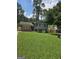 Charming home with a well-maintained lawn and a mix of brick and siding, nestled among mature trees, under a sunny sky at 993 Roosevelt Se Dr, Atlanta, GA 30354