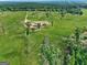 Aerial view of property featuring manicured lawn with surrounding greenery and expansive property at 357 Old Driver Rd, Whitesburg, GA 30185