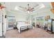 Bright bedroom with a decorative ceiling fan, and large windows, creating a relaxing and inviting space at 357 Old Driver Rd, Whitesburg, GA 30185