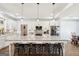 Modern kitchen island features granite countertops, brick accents, and modern appliances at 357 Old Driver Rd, Whitesburg, GA 30185
