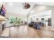 Large open living room with high ceilings, wood floors, and open access to the kitchen at 357 Old Driver Rd, Whitesburg, GA 30185