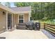 Outdoor patio area with seating and a grill, offering a relaxed space for outdoor cooking and entertaining at 8340 Highway 54, Sharpsburg, GA 30277