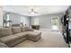 Basement featuring gym area and a cozy sectional sofa, offering versatile space for both recreation and relaxation at 8340 Highway 54, Sharpsburg, GA 30277