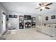 Spacious finished basement with recreational and storage areas, featuring a cozy seating area and ample shelving at 8340 Highway 54, Sharpsburg, GA 30277