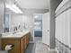 Bright bathroom features double sinks and a shower with updated fixtures at 8340 Highway 54, Sharpsburg, GA 30277