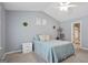 Bedroom features a ceiling fan, soft carpet, and modern decor at 8340 Highway 54, Sharpsburg, GA 30277