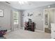 Bright bedroom with plush carpet, white trim, and natural light, perfect for a comfortable and inviting atmosphere at 8340 Highway 54, Sharpsburg, GA 30277