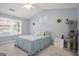 Cozy bedroom with a ceiling fan and a bright window at 8340 Highway 54, Sharpsburg, GA 30277